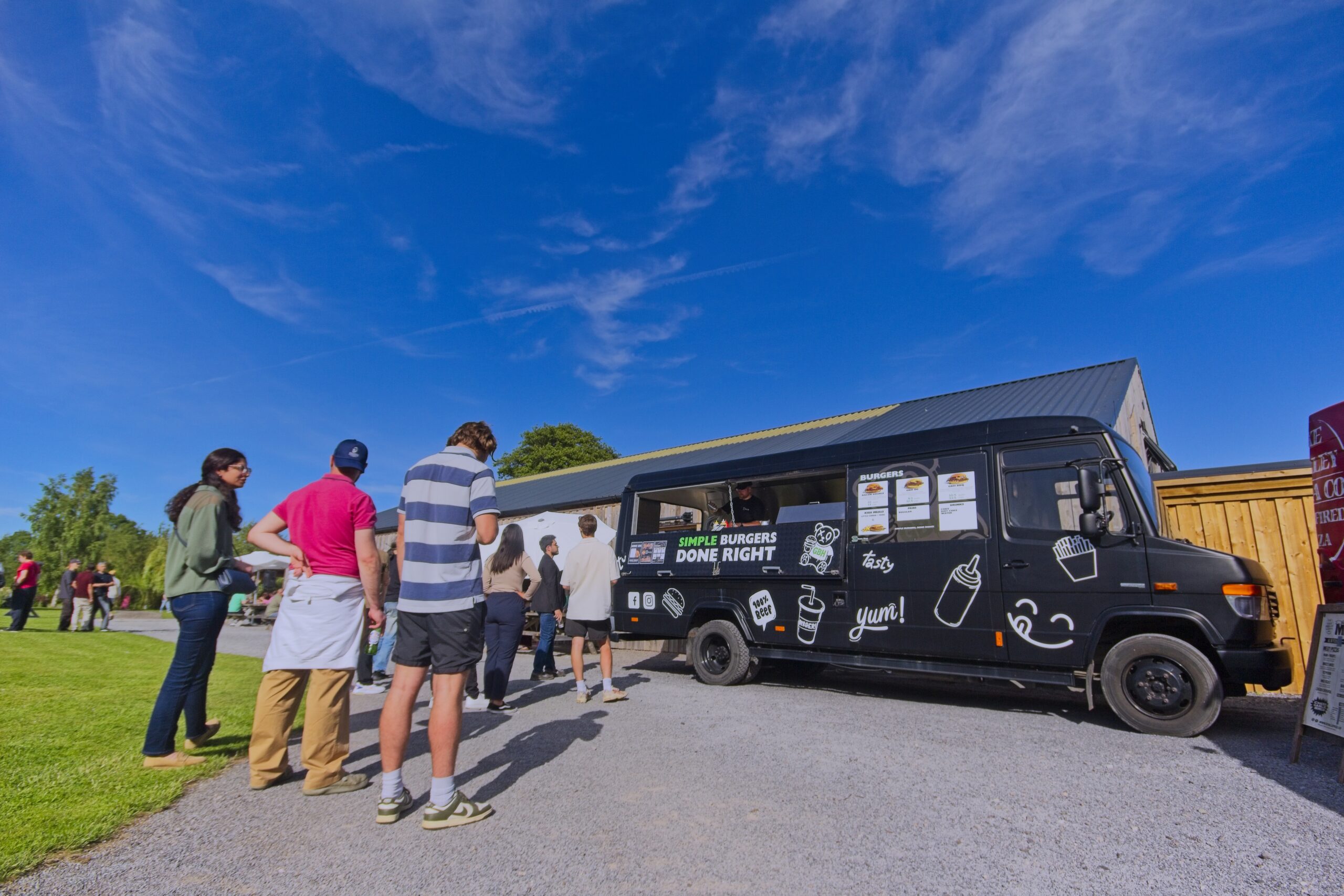 A queue of hungry smash burger fans at the GBH food truck at an event near Bristol